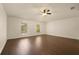 Bright bedroom featuring wood-look floors, natural light, and neutral walls, perfect for relaxation and comfort at 10930 Banyan Wood Way, Riverview, FL 33579
