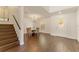 Bright dining area with chandelier, wood floors, and elegant wall paneling at 10930 Banyan Wood Way, Riverview, FL 33579