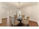 Dining area with modern chandelier, stylish chairs, and decorative wall accents at 10930 Banyan Wood Way, Riverview, FL 33579