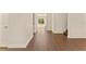 Spacious living room with wood floors and large windows for natural light at 10930 Banyan Wood Way, Riverview, FL 33579