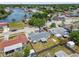 Aerial view of a single-Gathering home near a waterfront neighborhood and a canal, showing the fenced backyard at 1150 Grand Blvd, Holiday, FL 34690