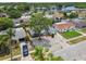 Residential neighborhood featuring a single-story home with zero-scape front yard and stone facade garage close to the water at 1150 Grand Blvd, Holiday, FL 34690