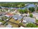 Aerial view showing a single-Gathering home with a fenced backyard in a waterfront neighborhood near a canal at 1150 Grand Blvd, Holiday, FL 34690