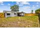Backyard with a covered patio area and views of the fenced yard at 1150 Grand Blvd, Holiday, FL 34690