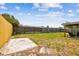 Large fenced backyard with a covered patio area at 1150 Grand Blvd, Holiday, FL 34690