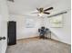 Spacious bedroom providing study or home office area and carpeted floors at 1150 Grand Blvd, Holiday, FL 34690