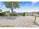 View of the house and driveway, stone accents with mature landscaping, and ample parking at 1150 Grand Blvd, Holiday, FL 34690
