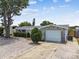 Charming single-story home featuring a stone facade garage and a well-maintained, zero-scape front yard at 1150 Grand Blvd, Holiday, FL 34690