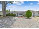 Charming single-story home with stone accents and a well-maintained front yard at 1150 Grand Blvd, Holiday, FL 34690
