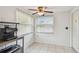 Cozy kitchen nook with bright light, ceiling fan, and tile floors. Perfect for enjoying a quick breakfast at 1150 Grand Blvd, Holiday, FL 34690