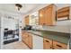 Well lit kitchen features wooden cabinets, lots of counter space, and white appliances at 1150 Grand Blvd, Holiday, FL 34690