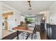 Spacious living room with hardwood floors, modern lighting, and an open floor plan to the kitchen at 1150 Grand Blvd, Holiday, FL 34690