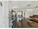 Inviting entrance view of open floor plan, showing dining and living room spaces with hardwood floors at 1150 Grand Blvd, Holiday, FL 34690