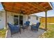 Patio with comfortable seating and ceiling fan, accessible via sliding glass doors at 1150 Grand Blvd, Holiday, FL 34690