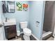 Stylish bathroom features modern fixtures, gray tile, and blue accent wall at 116 W Chelsea St, Tampa, FL 33603