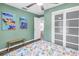 Charming bedroom with bright walls, wood floors, and a sliding door closet, creating a cozy and inviting space at 116 W Chelsea St, Tampa, FL 33603