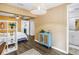 Comfortable bedroom featuring modern decor, wood flooring, and an open layout to an ensuite bathroom, providing convenience at 116 W Chelsea St, Tampa, FL 33603