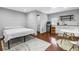 Studio apartment with hardwood floors, bed, bathroom, dining table, and kitchenette at 116 W Chelsea St, Tampa, FL 33603