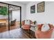 Cozy sitting area with plush armchairs, stylish decor, and sliding glass doors to outdoor deck at 116 W Chelsea St, Tampa, FL 33603