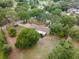 Beautiful aerial view showcasing a home nestled among trees, offering a sense of privacy at 1204 Ballinger Rd, Lutz, FL 33548