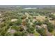 Aerial view of a single-Gathering home and its surrounding neighborhood, pointing out the subject property's location at 1204 Ballinger Rd, Lutz, FL 33548