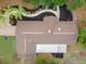 Aerial view of home showcasing the roof and landscape at 1204 Ballinger Rd, Lutz, FL 33548