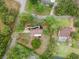 Aerial view featuring mature trees and landscaping near the property at 1204 Ballinger Rd, Lutz, FL 33548