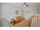 Bedroom with a dresser, closet, round mirror, neutral paint and flooring, and play area at 1204 Ballinger Rd, Lutz, FL 33548