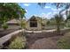 Charming one-story home with large windows, lush landscaping, and a welcoming walkway at 1204 Ballinger Rd, Lutz, FL 33548