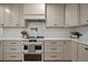Modern kitchen with stainless steel appliances, quartz countertops, and custom cabinetry at 1204 Ballinger Rd, Lutz, FL 33548