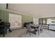 Spacious covered patio with comfortable seating and a dining area, perfect for outdoor gatherings at 1204 Ballinger Rd, Lutz, FL 33548