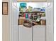 Convenient laundry area with shelving and a washer/dryer, designed for efficient household tasks and storage at 12307 Villager Ct, Tampa, FL 33625