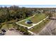 Scenic park with a green gazebo, walking paths, and a pond with a fountain, perfect for recreation at 12307 Villager Ct, Tampa, FL 33625