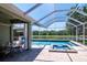Entertain guests in this backyard featuring a pool, spa, summer kitchen and beautiful water views at 12309 Creek Edge Dr, Riverview, FL 33579
