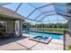 This outdoor oasis has a pool, spa and screened enclosure, ideal for enjoying the water view at 12309 Creek Edge Dr, Riverview, FL 33579