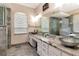 Modern bathroom featuring dual vanity, glass shower, soaking tub, and stylish fixtures at 12309 Creek Edge Dr, Riverview, FL 33579
