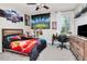 Bedroom features wood furnishings, neutral carpeting, and a dedicated desk space at 12309 Creek Edge Dr, Riverview, FL 33579