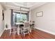 This dining room has natural light and hard wood floors at 12309 Creek Edge Dr, Riverview, FL 33579