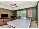 Spacious game room with a ping pong table and great view of the lake at 12309 Creek Edge Dr, Riverview, FL 33579