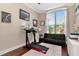 Well-lit home office featuring a treadmill and futon at 12309 Creek Edge Dr, Riverview, FL 33579