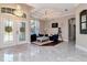 Elegant living room showcases high ceilings, chandelier, and an abundance of natural light at 12309 Creek Edge Dr, Riverview, FL 33579