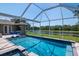Enjoy the beautiful lake views from your private pool and spa area with screened-in enclosure at 12309 Creek Edge Dr, Riverview, FL 33579