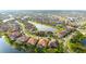 Breathtaking aerial showing homes around a lake, offering waterfront views and a tranquil, connected community at 13327 Waterleaf Garden Cir, Riverview, FL 33579