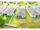 Aerial view of a home's spacious backyard with a covered patio and green lawn at 13327 Waterleaf Garden Cir, Riverview, FL 33579