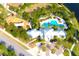 Aerial photograph highlighting community amenities: pool, playground, clubhouse, walking paths, and ample green space at 13327 Waterleaf Garden Cir, Riverview, FL 33579