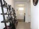 Front entryway featuring decorative ladder shelving on a tiled floor at 13327 Waterleaf Garden Cir, Riverview, FL 33579