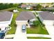 Beautiful one-story home showcasing a well-kept lawn and an attached two-car garage at 13327 Waterleaf Garden Cir, Riverview, FL 33579