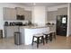 Charming kitchen features granite counters, stainless steel appliances, and ample cabinet space at 13327 Waterleaf Garden Cir, Riverview, FL 33579