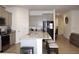 Bright kitchen with bar seating, stainless steel appliances and granite countertops at 13327 Waterleaf Garden Cir, Riverview, FL 33579