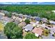 Bird's eye view of a neighborhood near a pond, offering a blend of nature and suburban comfort at 13523 Prestwick Dr, Riverview, FL 33579